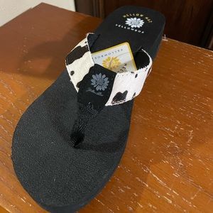 Yellowbox Mellow Mat flip flops with black & white cow print. Size 9M